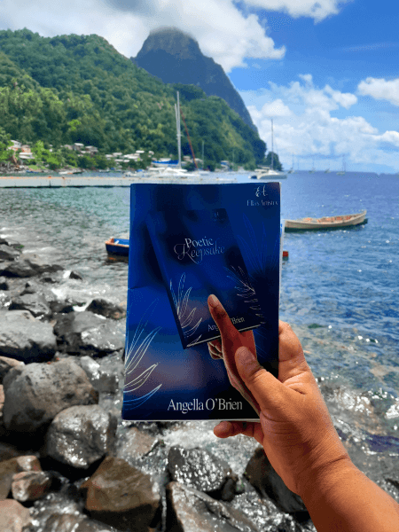 Image of Poetic Keepsake being held up on a beach