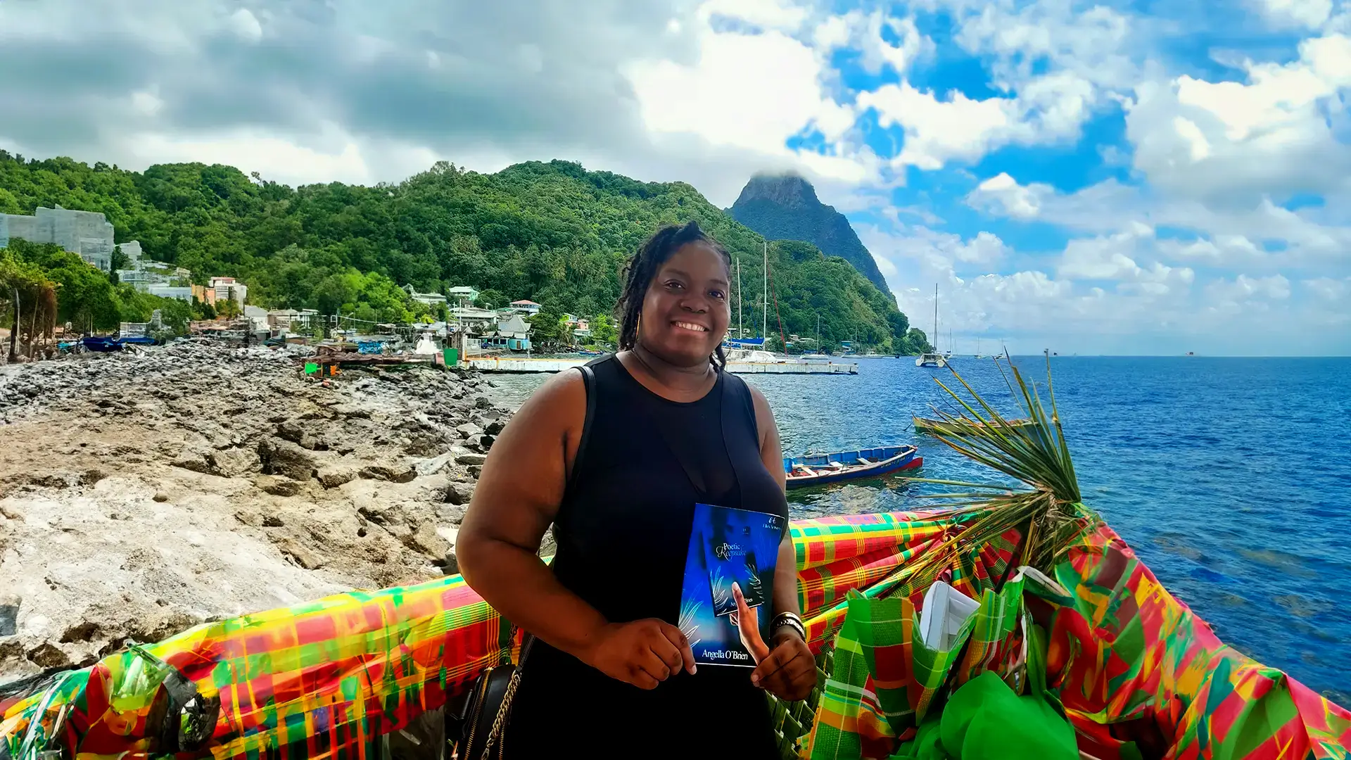 Angella holding Poetic Keepsake on a beach